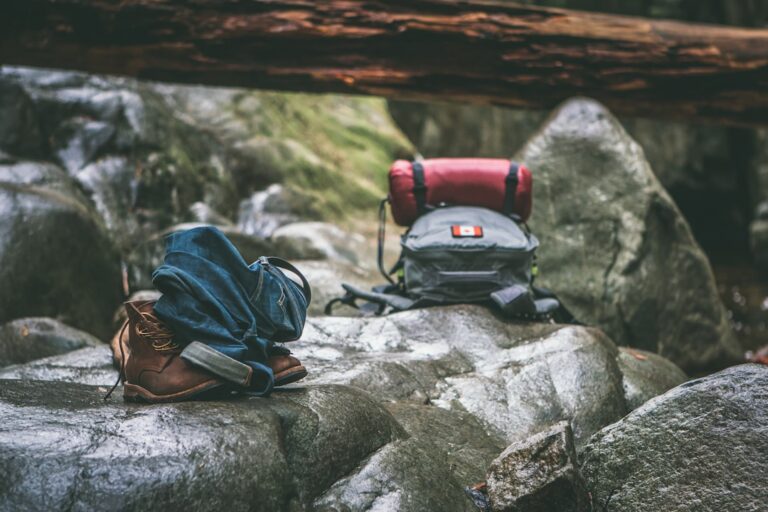 A well-organized hiking backpack with gear neatly packed, set against a scenic outdoor backdrop.