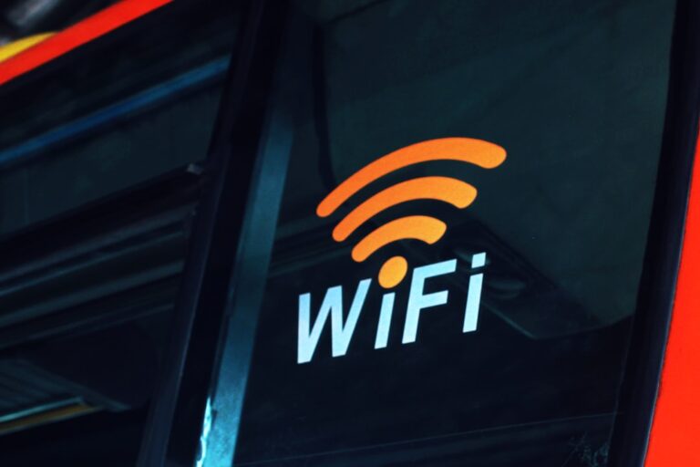 A cozy living room with a modern router and various smart devices connected, illustrating strong Wi-Fi coverage.
