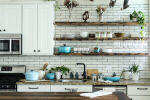 A well-organized small kitchen with efficient storage solutions and clear counter space.