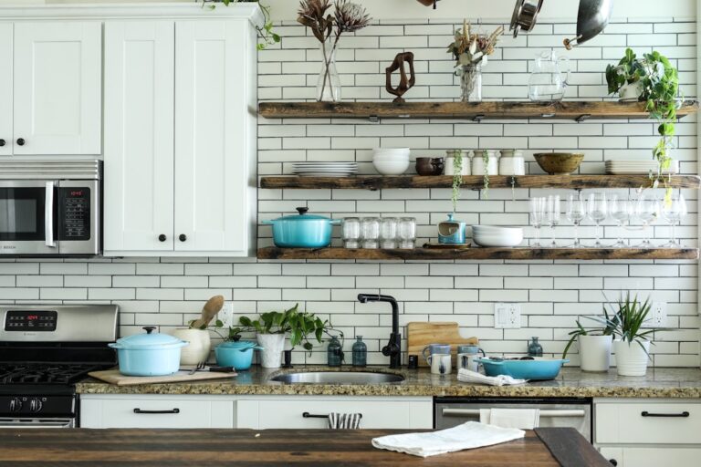 A well-organized small kitchen with efficient storage solutions and clear counter space.