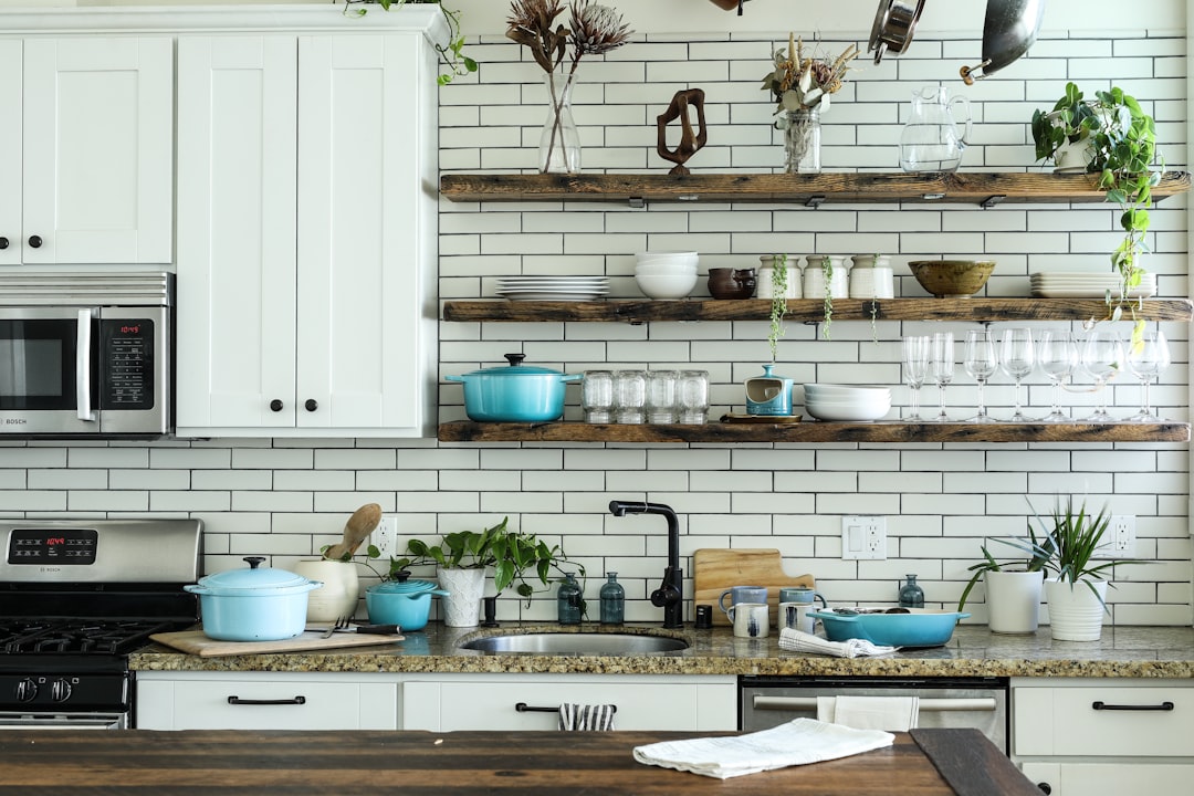 A well-organized small kitchen with efficient storage solutions and clear counter space.